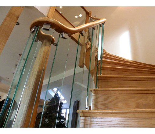 Close up of curved stairs with glass